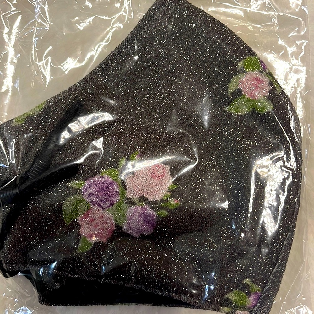 Charcoal glitter face mask with flowers